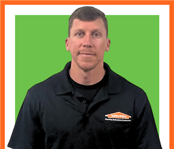 Jason Landers, male, SERVPRO employee in front of green sign, white background