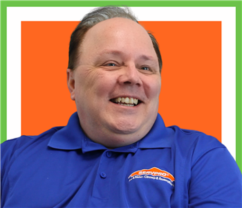 Bill Repsel for SERVPRO photo on white wall, male employee