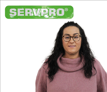 Shannon Bruening Posing for Company Photo Under A SERVPRO Sign