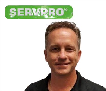 Bill Shook for SERVPRO on wall 