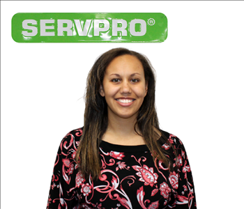 Kaileigh Plant Under The SERVPRO Sign For Her Employee Photo