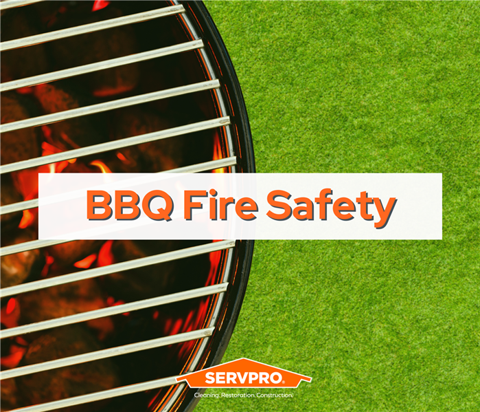 the left half of the image is a bbq grill, the right half is grass, the grill has flames and words "bbq fire safety", SERVPRO